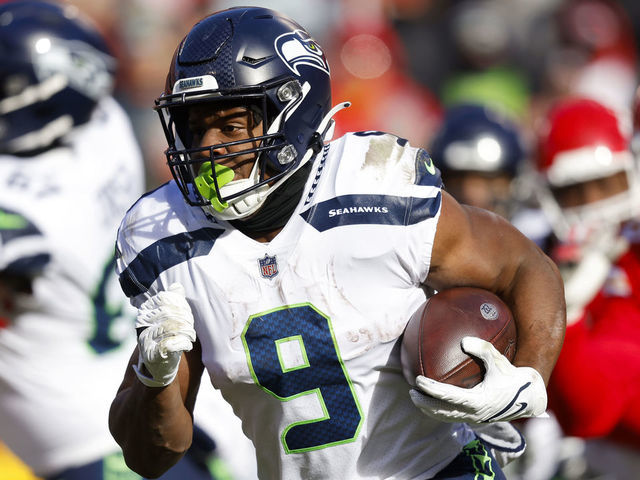 KANSAS CITY, MISSOURI - DECEMBER 24: Kenneth Walker III #9 of the Seattle Seahawks runs the ball during the second quarter against the Kansas City Chiefs at Arrowhead Stadium on December 24, 2022 in Kansas City, Missouri.