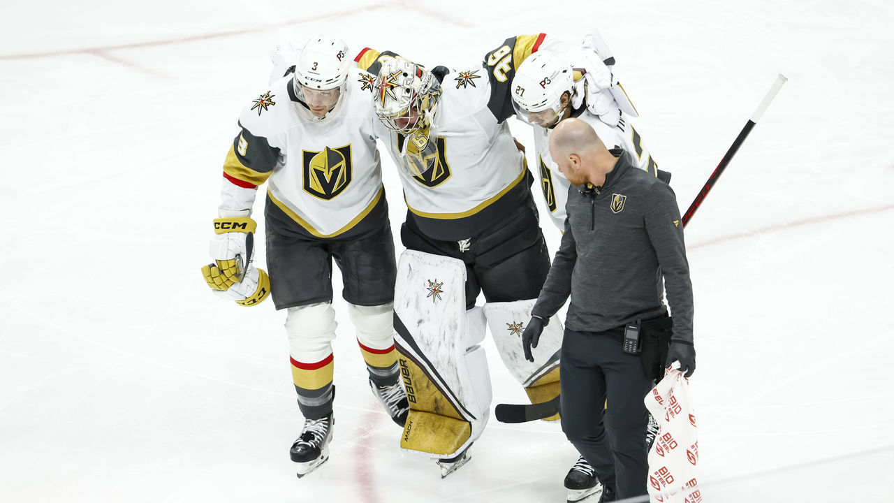 ST PAUL, MN - FEBRUARY 09: Logan Thompson #36 of the Vegas Golden Knights is helped off the ice after getting injured against the Minnesota Wild in the third period of the game at Xcel Energy Center on February 9, 2023 in St Paul, Minnesota. Thompson did not return to the game. The Golden Knights defeated the Wild 5-1.