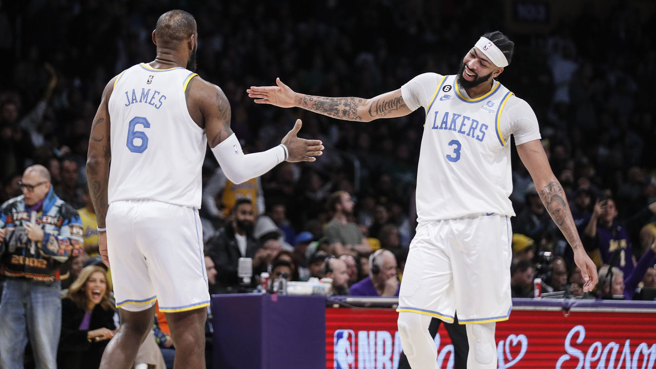 Los Angeles, CA, Tuesday, December 13, 2022 - Los Angeles Lakers forward Anthony Davis (3) celebrates with LeBron James after they teamed up for a basket in the second half against the Boston Celtics at Crypto.Com Arena. (Robert Gauthier/Los Angeles Times via Getty Images)