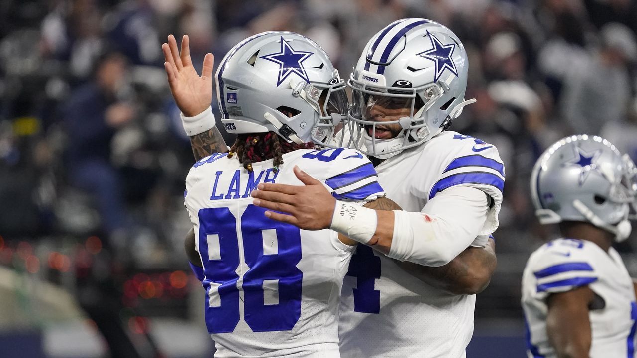 ARLINGTON, TEXAS - DECEMBER 24: CeeDee Lamb #88 of the Dallas Cowboys is congratulated by Dak Prescott #4 after scoring a touchdown during the second quarter of a game against the Philadelphia Eagles at AT&T Stadium on December 24, 2022 in Arlington, Texas.