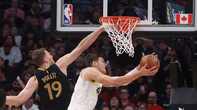 TORONTO, ON- FEBRUARY 10 - Toronto Raptors forward Jacob Poeltl (19) defends against Utah Jazz forward Lauri Markkanen (23) as the Toronto Raptors fall to the Utah Jazz 122-116 at Scotiabank Arena in Toronto. February 10, 2023. (Steve Russell/Toronto Star via Getty Images)