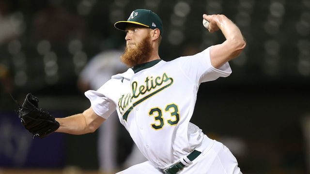 OAKLAND, CALIFORNIA - SEPTEMBER 21: A.J. Puk #33 of the Oakland Athletics pitches against the Seattle Mariners at RingCentral Coliseum on September 21, 2022 in Oakland, California.