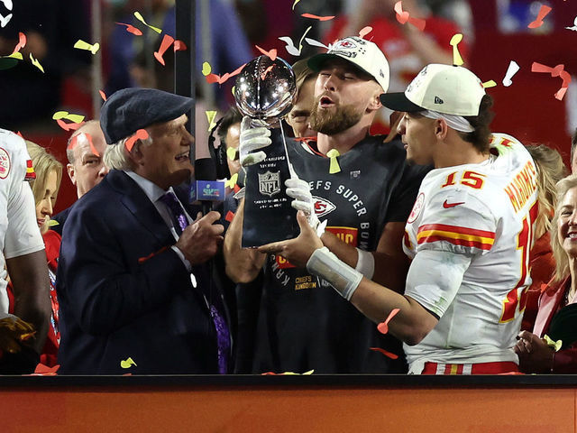 Kansas City Chiefs tight end Travis Kelce (87) holds up the Vince Lombardi  Trophy after the NFL Super Bowl 54 football game between the San Francisco  49ers and Kansas City Chiefs Sunday