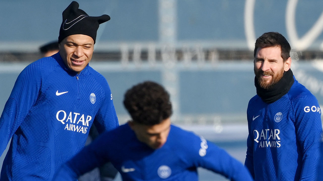 Paris Saint-Germain's French forward Kylian Mbappe (L) and Paris Saint-Germain's Argentine forward Lionel Messi take part in a training session in Saint-Germain-en-Laye, west of Paris on February 13, 2023, on the eve of the UEFA Champions League round of Last 16 First leg football match against FC Bayern Munich.