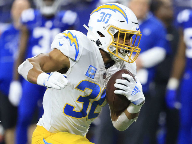 INDIANAPOLIS, INDIANA - DECEMBER 26: Austin Ekeler #30 of the Los Angeles Chargers runs the ball in the game against the Indianapolis Colts at Lucas Oil Stadium on December 26, 2022 in Indianapolis, Indiana.
