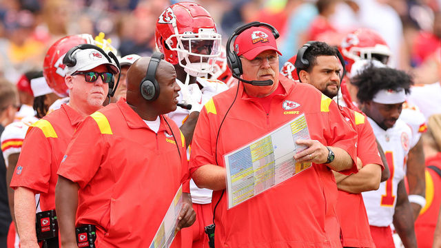 CHICAGO, ILLINOIS - AUGUST 13: Offensive coordinator Eric Bieniemy and head coach Andy Reid of the Kansas City Chiefs talk against the Chicago Bears during the first half of the preseason game at Soldier Field on August 13, 2022 in Chicago, Illinois.