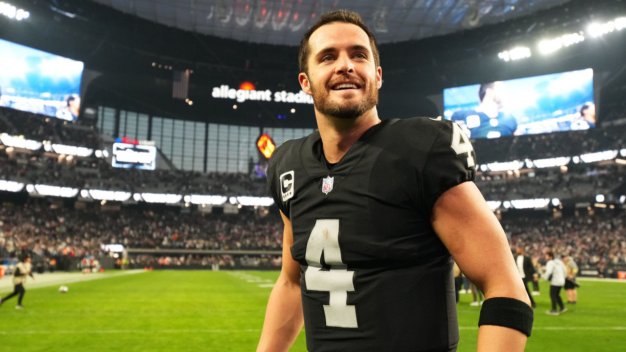 LAS VEGAS, NEVADA - DECEMBER 18: Derek Carr #4 of the Las Vegas Raiders celebrates on the field after defeating the New England Patriots at Allegiant Stadium on December 18, 2022 in Las Vegas, Nevada.