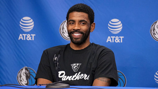 DALLAS, TX - FEBRUARY 13: Kyrie Irving #2 of the Dallas Mavericks smiles in an interview prior to the game against the Minnesota Timberwolves on February 13, 2023 at the American Airlines Center in Dallas, Texas. Mandatory Copyright Notice: Copyright 2023 NBAE
