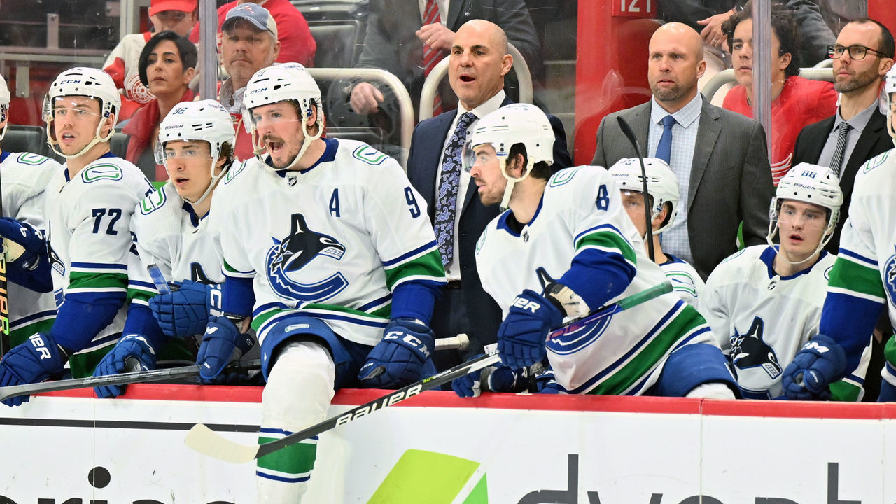 DETROIT, MI - FEBRUARY 11: Vancouver Canucks Head Coach Rick Tocchet calls out to the ice during the game between Vancouver Canucks and Detroit Red Wings on February 11, 2023 at Little Caesars Arena in Detroit, MI
