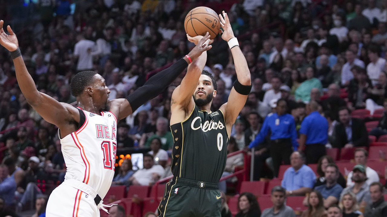 MIAMI, FLORIDA - JANUARY 24: Jayson Tatum #0 of the Boston Celtics attempts a shot while being defended by Bam Adebayo #13 of the Miami Heat during the second half of the game at Miami-Dade Arena on January 24, 2023 in Miami, Florida. NOTE TO USER: User expressly acknowledges and agrees that, by downloading and or using this photograph, User is consenting to the terms and conditions of the Getty Images License Agreement.