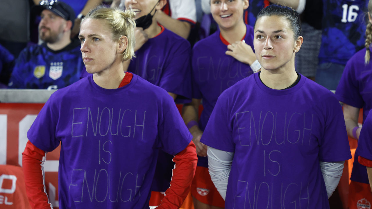 ORLANDO, FLORIDA - FEBRUARY 16: (L-R) Sophie Schmidt #13 and Sabrina D'Angelo #18 of Canada look on as they wear purple shirts that read, "Enough is Enough" prior to the 2023 SheBelieves Cup match against the United States at Exploria Stadium on February 16, 2023 in Orlando, Florida.