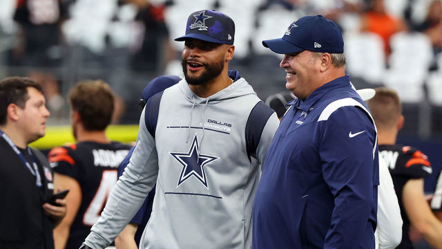 ARLINGTON, TEXAS - SEPTEMBER 18: Dak Prescott of the Dallas Cowboys and head coach Mike McCarthy visit during warmups before the game against the Cincinnati Bengals at AT&T Stadium on September 18, 2022 in Arlington, Texas.