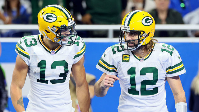 Green Bay Packers wide receiver Allen Lazard (13) talks with Green Bay Packers quarterback Aaron Rodgers (12) after a play during an NFL football game between the Detroit Lions and the Green Bay Packers in Detroit, Michigan USA, on Sunday, January 9, 2022.