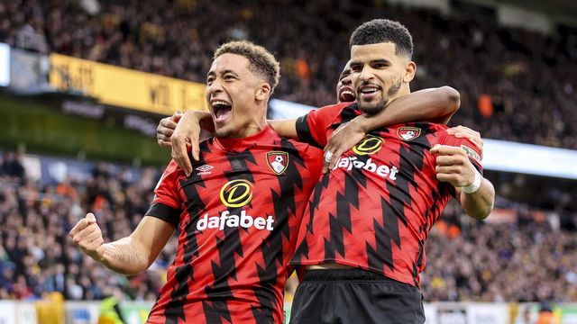 WOLVERHAMPTON, ENGLAND - FEBRUARY 18: Marcus Tavernier of Bournemouth celebrates with team-mates Dominic Solanke and Hamed Traore after he scores a goal to make it 1-0 during the Premier League match between Wolverhampton Wanderers and AFC Bournemouth at Molineux on February 18, 2023 in Wolverhampton, England.