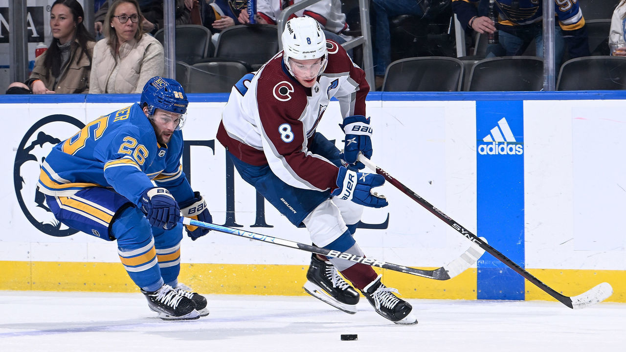 ST. LOUIS, MO - FEBRUARY 18: Nathan Walker #26 of the St. Louis Blues and Cale Makar #8 of the Colorado Avalanche battle for the puck at the Enterprise Center on February 18, 2023 in St. Louis, Missouri.