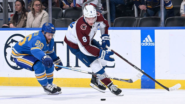 ST. LOUIS, MO - FEBRUARY 18: Nathan Walker #26 of the St. Louis Blues and Cale Makar #8 of the Colorado Avalanche battle for the puck at the Enterprise Center on February 18, 2023 in St. Louis, Missouri.