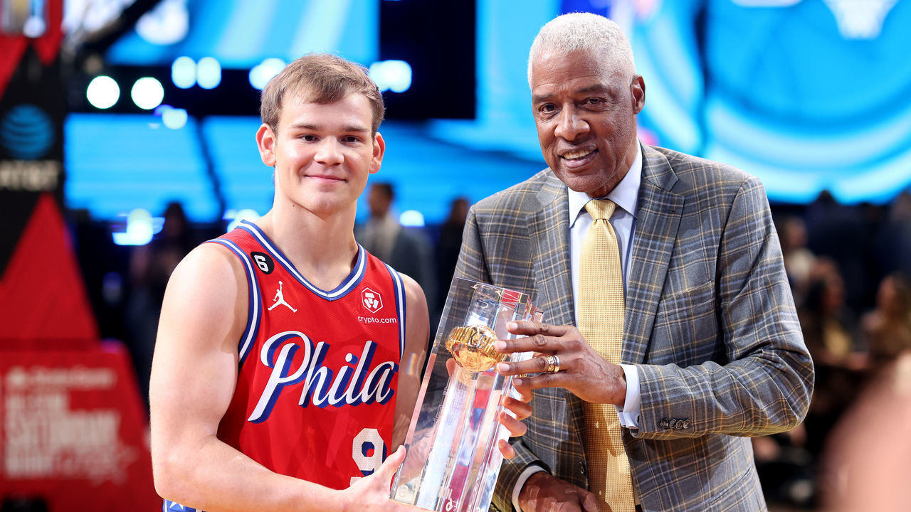 SALT LAKE CITY, UTAH - FEBRUARY 18: Mac McClung #9 of the Philadelphia 76ers and former professional basketball player Julius Erving and pose with the trophy after McClung's victory in the 2023 NBA All Star AT&T Slam Dunk Contest at Vivint Arena on February 18, 2023 in Salt Lake City, Utah.