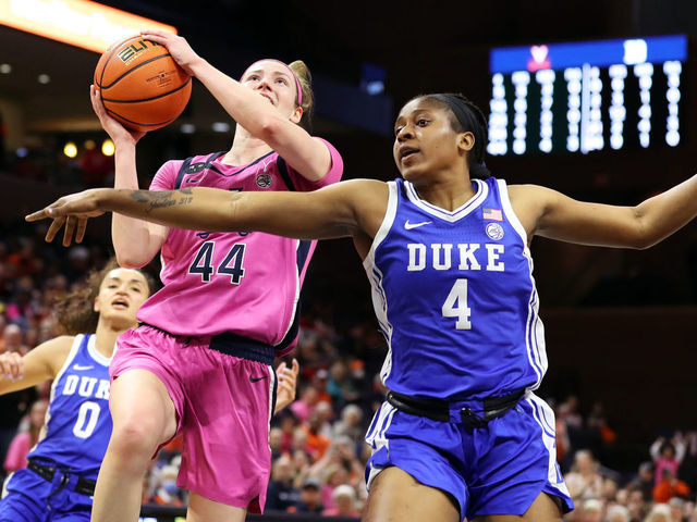 CHARLOTTESVILLE, VA - FEBRUARY 19: McKenna Dale #44 of the Virginia Cavaliers shoots over Elizabeth Balogun #4 of the Duke Blue Devils in the second half during a game at John Paul Jones Arena on February 19, 2023 in Charlottesville, Virginia.