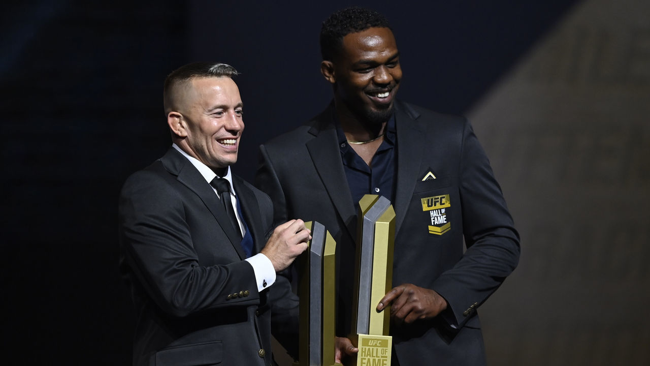 LAS VEGAS, NEVADA - SEPTEMBER 23: Georges St-Pierre and Jon Jones pose for photos during the UFC Hall of Fame Class of 2020 Induction Ceremony at Park Theater at Park MGM on September 23, 2021 in Las Vegas, Nevada.