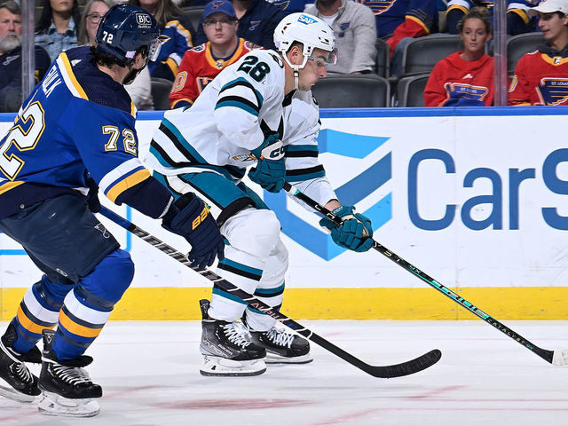 ST. LOUIS, MO - NOVEMBER 10: Justin Faulk #72 of the St. Louis Blues defends against Timo Meier #28 of the San Jose Sharks at the Enterprise Center on November 10, 2022 in St. Louis, Missouri.