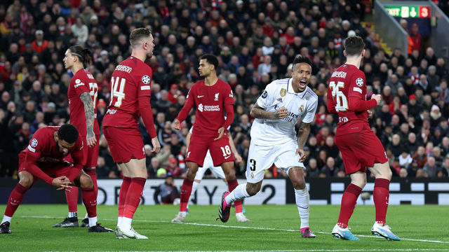LIVERPOOL, ENGLAND - FEBRUARY 21: Eder Militao of Real Madrid celebrates after scoring the team's second goal as players of Liverpool react during the UEFA Champions League round of 16 leg one match between Liverpool FC and Real Madrid at Anfield on February 21, 2023 in Liverpool, England.