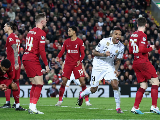 LIVERPOOL, ENGLAND - FEBRUARY 21: Eder Militao of Real Madrid celebrates after scoring the team's second goal as players of Liverpool react during the UEFA Champions League round of 16 leg one match between Liverpool FC and Real Madrid at Anfield on February 21, 2023 in Liverpool, England.