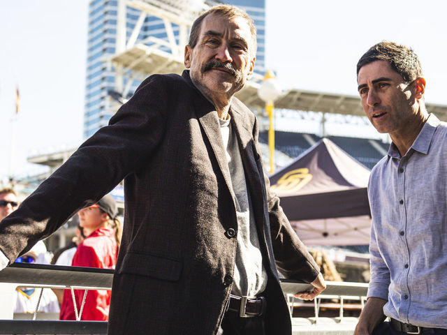 SAN DIEGO, CA - FEBRUARY 04: San Diego Padres Chairman Peter Seidler and President of Baseball Operations and General Manager A.J. Preller talk during the San Diego Padres Fan Fest at PETCO Park on February 4, 2023 in San Diego, California.