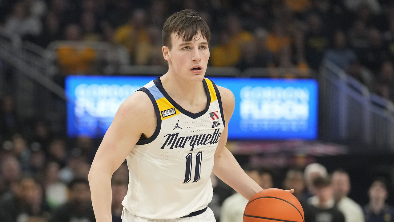 MILWAUKEE, WISCONSIN - FEBRUARY 15: Tyler Kolek #11 of the Marquette Golden Eagles dribbles the ball against the Xavier Musketeers during the first half at Fiserv Forum on February 15, 2023 in Milwaukee, Wisconsin.