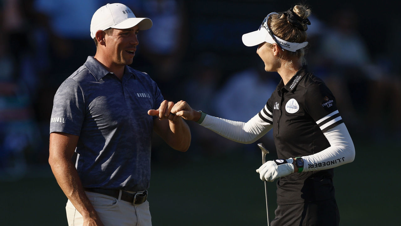 NAPLES, FLORIDA - DECEMBER 10: Scott Stallings and Nelly Korda of the United States fist pump on the 18th green during round two of the QBE Shootout at Tiburon Golf Club on December 10, 2022 in Naples, Florida.