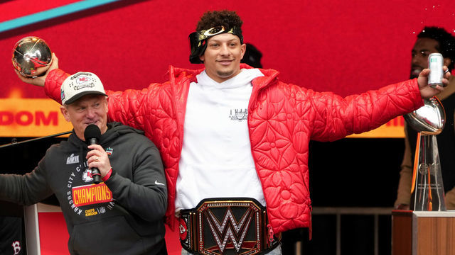KANSAS CITY, MISSOURI - FEBRUARY 15: Patrick Mahomes #15 of the Kansas City Chiefs celebrates on stage during the Kansas City Chiefs Super Bowl LVII victory parade on February 15, 2023 in Kansas City, Missouri.