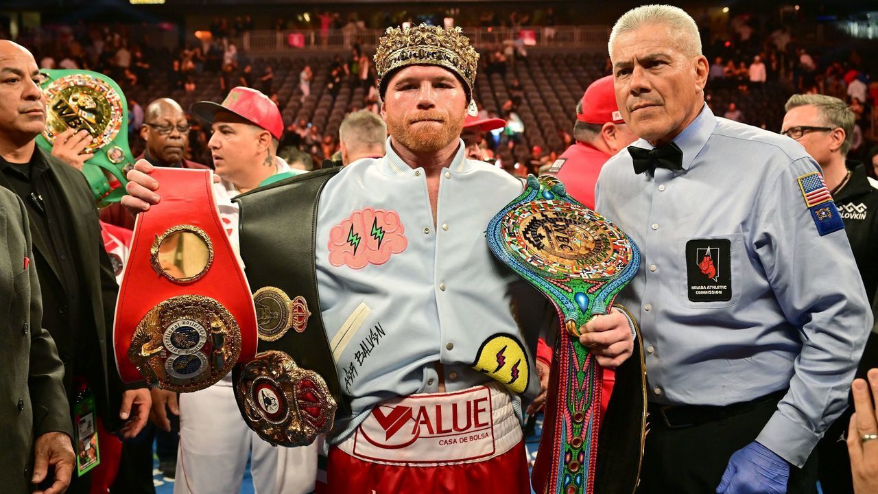 TOPSHOT - Mexican boxer Saul "Canelo" Alvarez poses with his belts and crown after defeating Kazakh boxer Gennady Golovkin to retain his undisputed super-middleweight crown at T-Mobile Arena in Las Vegas, Nevada, September 17, 2022.