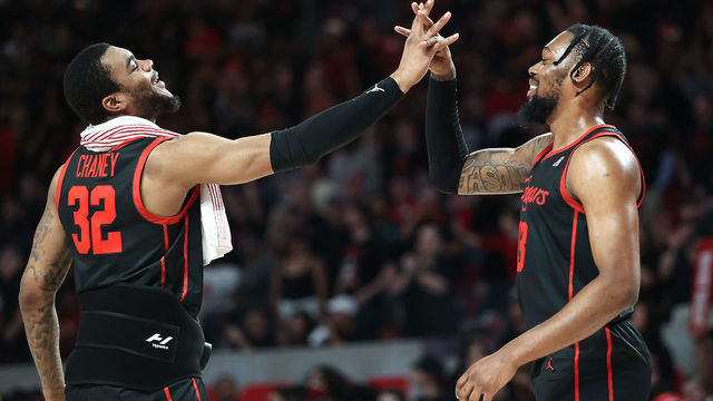 HOUSTON, TEXAS - FEBRUARY 22: J'Wan Roberts #13 of the Houston Cougars high fives Reggie Chaney #32 during the second half against the Tulane Green Wave at Fertitta Center on February 22, 2023 in Houston, Texas.