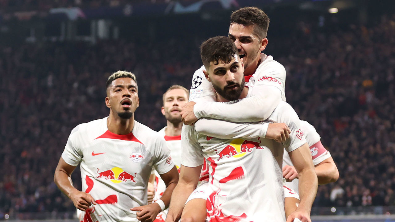 LEIPZIG, GERMANY - FEBRUARY 22: Josko Gvardiol of RB Leipzig celebrates with teammates after scoring the team's first goal during the UEFA Champions League round of 16 leg one match between RB Leipzig and Manchester City at Red Bull Arena on February 22, 2023 in Leipzig, Germany.