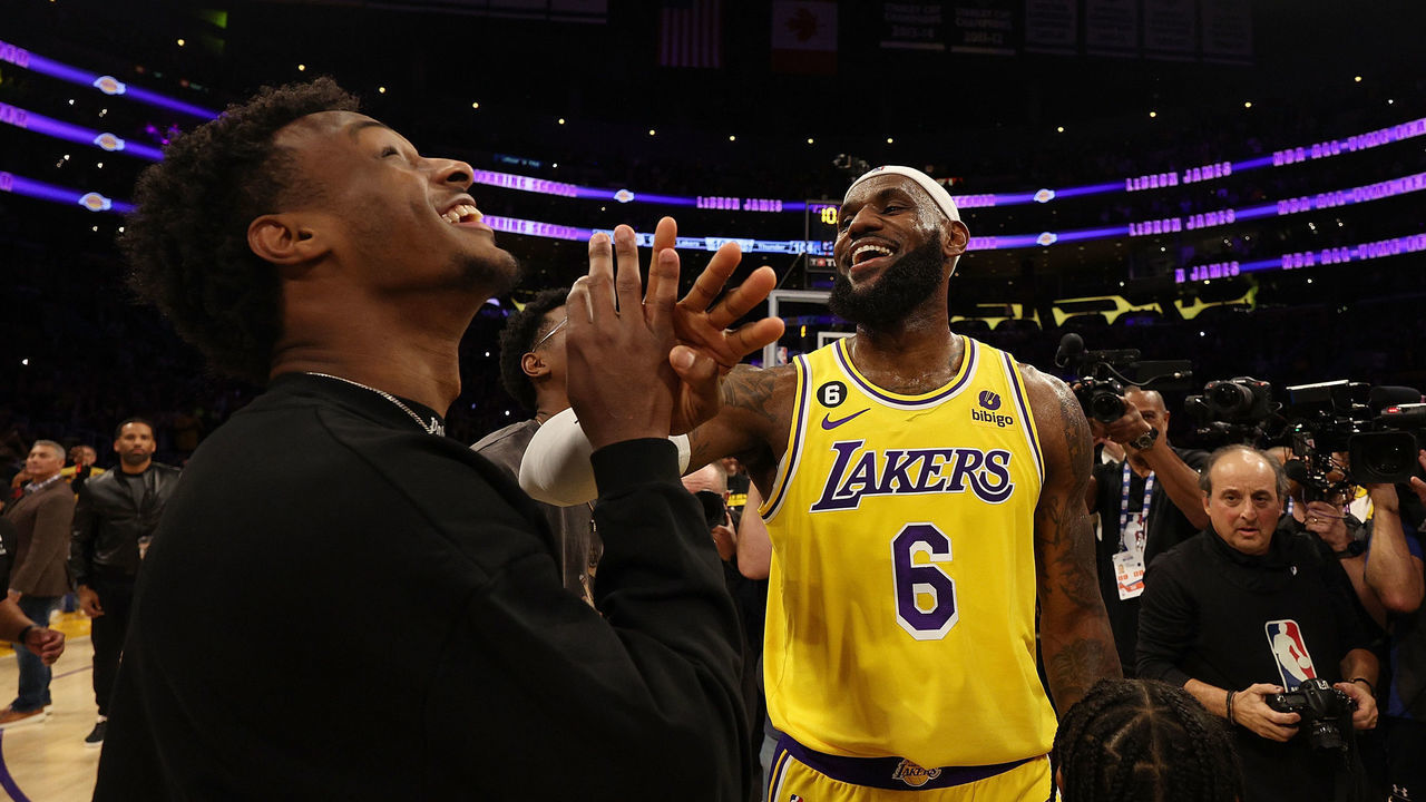 LOS ANGELES, CALIFORNIA - FEBRUARY 07: LeBron James #6 of the Los Angeles Lakers reacts with Bronny James after scoring to pass Kareem Abdul-Jabbar to become the NBA's all-time leading scorer, surpassing Abdul-Jabbar's career total of 38,387 points against the Oklahoma City Thunder at Crypto.com Arena on February 07, 2023 in Los Angeles, California.