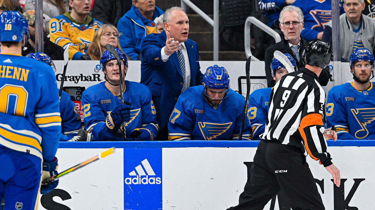 ST. LOUIS, MO - JANUARY 14: St. Louis Blues head coach Craig Berube questions referee Dan O'Rourke (9) on why there was not a penalty called during a game between the Tampa Bay Lightning and the St. Louis Blues on January 14, 2023, at the Enterprise Center in St. Louis MO