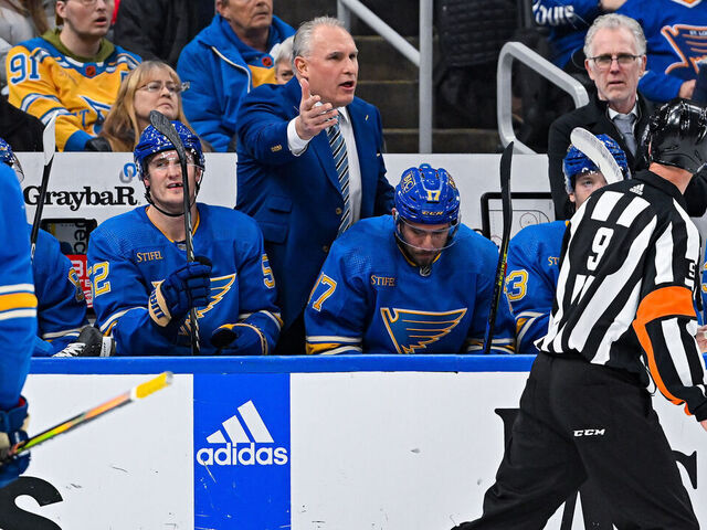 ST. LOUIS, MO - JANUARY 14: St. Louis Blues head coach Craig Berube questions referee Dan O'Rourke (9) on why there was not a penalty called during a game between the Tampa Bay Lightning and the St. Louis Blues on January 14, 2023, at the Enterprise Center in St. Louis MO