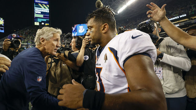SEATTLE, WASHINGTON - SEPTEMBER 12: Head coach Pete Carroll of the Seattle Seahawks and Russell Wilson #3 of the Denver Broncos shake hands after their game at Lumen Field on September 12, 2022 in Seattle, Washington.