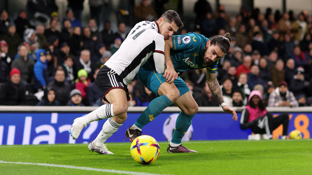 LONDON, ENGLAND - FEBRUARY 24: Ruben Neves of Wolverhampton Wanderers battles for possession with Manor Solomon of Fulham during the Premier League match between Fulham FC and Wolverhampton Wanderers at Craven Cottage on February 24, 2023 in London, England.