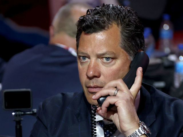 MONTREAL, QUEBEC - JULY 08: General manager Bill Guerin of the Minnesota Wild looks on from the draft table during the 2022 Upper Deck NHL Draft at Bell Centre on July 08, 2022 in Montreal, Quebec.