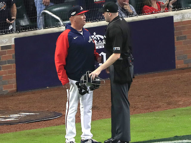 ATLANTA, GA - OCTOBER 12: Atlanta Braves manager Brian Snitker (43) confers with the umpire about a foul ball call during Game 2 of the NLDS between the Atlanta Braves and the Philadelphia Phillies on October 12, 2022 at Truist Park in Atlanta, Georgia.