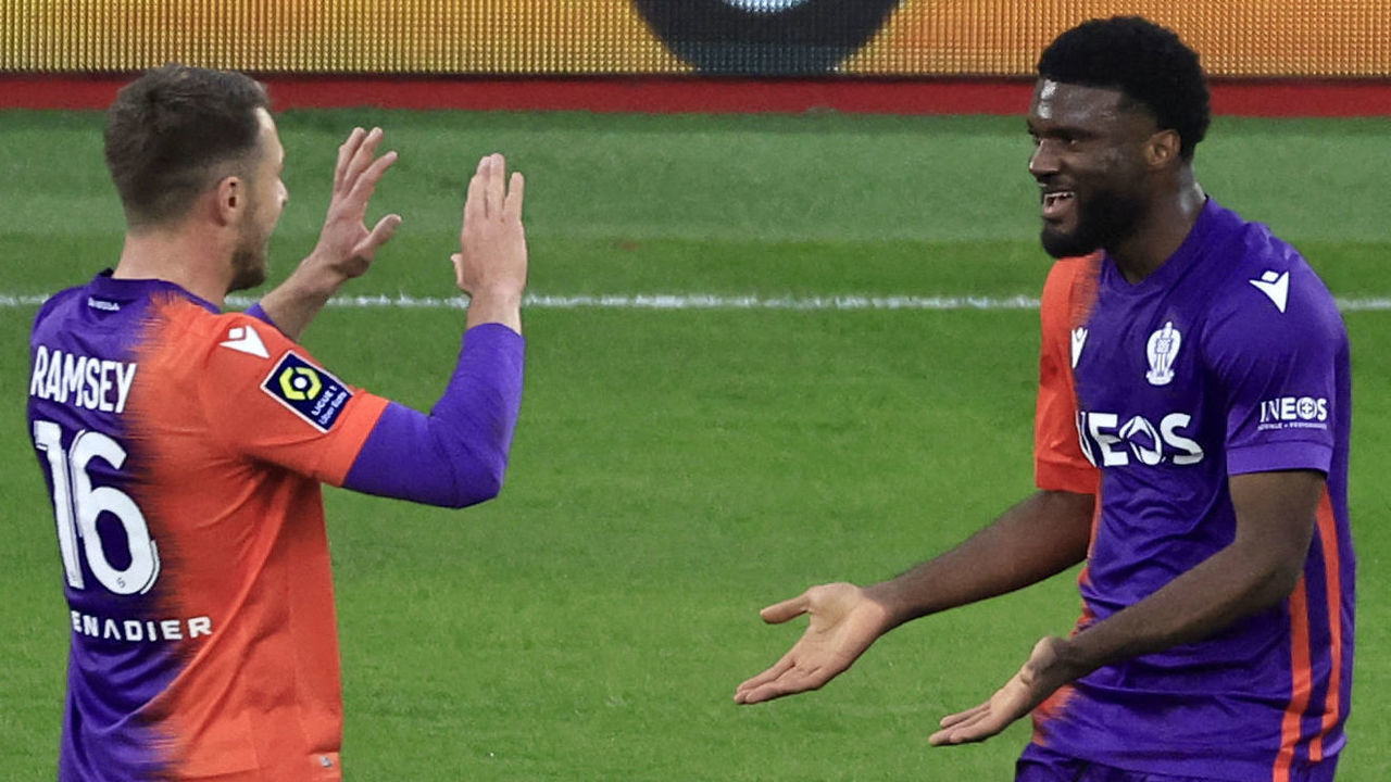 Nice's Nigerian forward Terem Moffi (R) celebrates after scoring a second goal during the French L1 football match between AS Monaco and OGC Nice at the Louis II Stadium (Stade Louis II) in the Principality of Monaco on February 26, 2023.