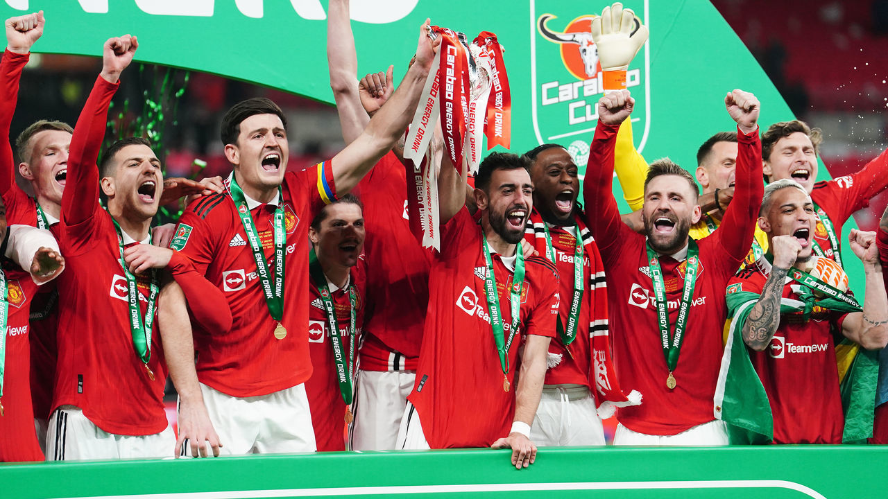 Manchester United players lift the trophy following the Carabao Cup Final match at Wembley Stadium, London. Picture date: Sunday February 26, 2023.