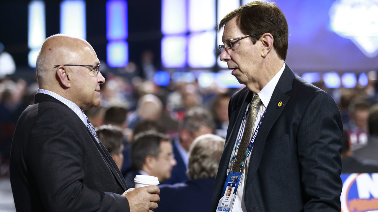 VANCOUVER, BRITISH COLUMBIA - JUNE 22: Head coach Barry Trotz (L) of the New York Islanders and general manager David Poile of the Nashville Predators talk on the draft floor during Rounds 2-7 of the 2019 NHL Draft at Rogers Arena on June 22, 2019 in Vancouver, Canada.