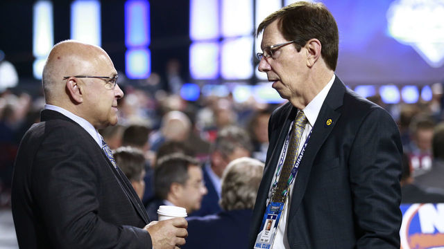 VANCOUVER, BRITISH COLUMBIA - JUNE 22: Head coach Barry Trotz (L) of the New York Islanders and general manager David Poile of the Nashville Predators talk on the draft floor during Rounds 2-7 of the 2019 NHL Draft at Rogers Arena on June 22, 2019 in Vancouver, Canada.