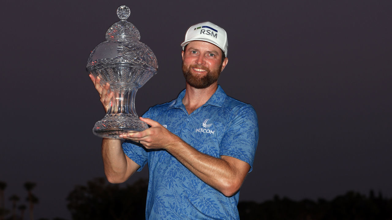 PALM BEACH GARDENS, FLORIDA - FEBRUARY 26: Chris Kirk of the United States stands with the trophy after winning The Honda Classic at PGA National Resort And Spa on February 26, 2023 in Palm Beach Gardens, Florida.