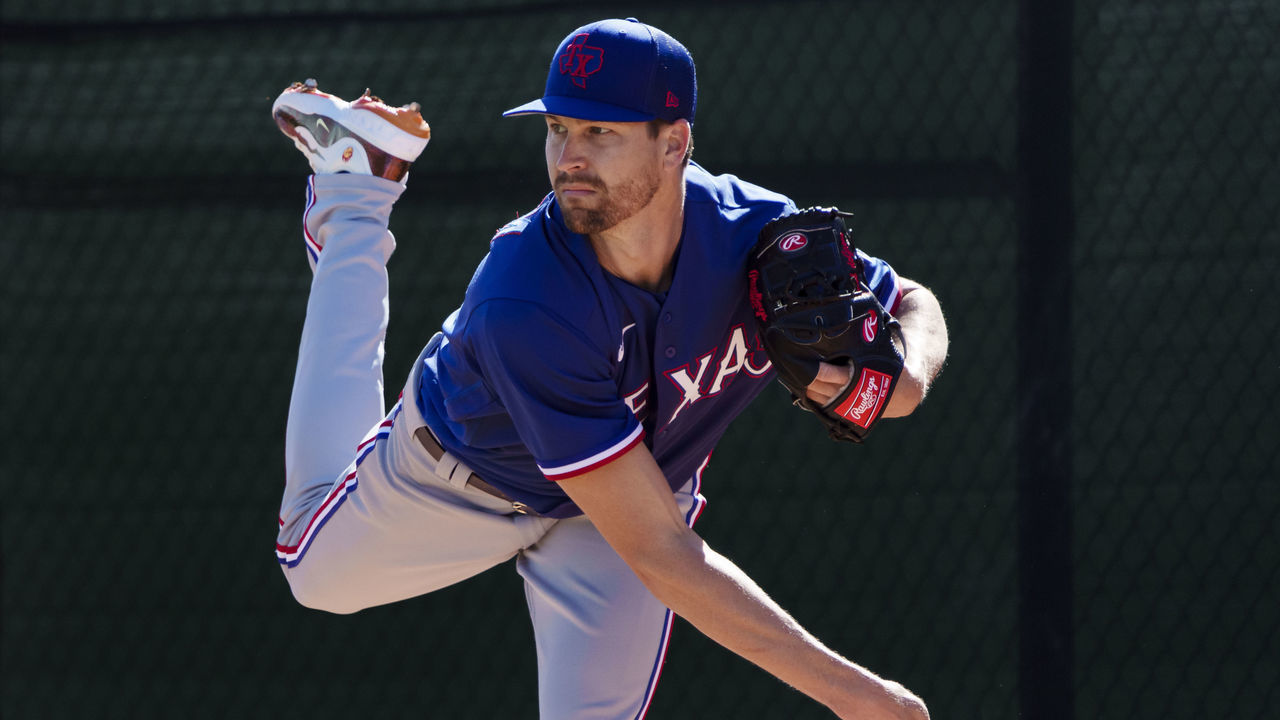 SURPRISE, AZ - FEBRUARY 23: Jacob deGrom #48 of the Texas Rangers delivers a pitch during a spring training team workout at Surprise Stadium on February 23, 2023 in Surprise, Arizona.