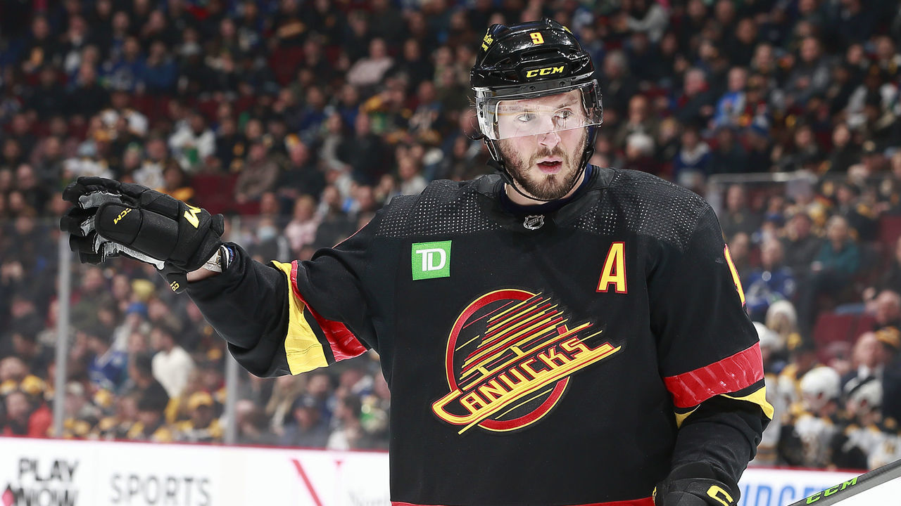 VANCOUVER, CANADA - FEBRUARY 25: J.T. Miller #9 of the Vancouver Canucks lines up for a face-off during their NHL game against the Boston Bruins at Rogers Arena February 25, 2023 in Vancouver, British Columbia, Canada.