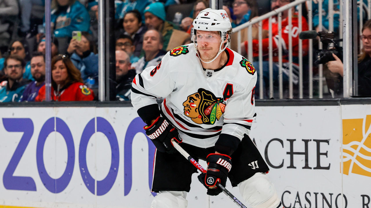 SAN JOSE, CA - FEBRUARY 25: Chicago Blackhawks Defenceman Jake McCabe (6) controls the puck tduring the NHL professional mens hockey game between the Chicago Blackhawks and San Jose Sharks on February 25, 2023 at the SAP Center in San Jose, CA.