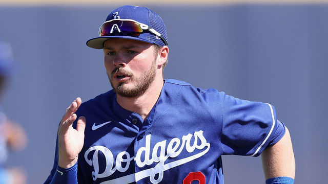 PEORIA, ARIZONA - FEBRUARY 27: Gavin Lux #9 of the Los Angeles Dodgers warms up before the spring training game against the San Diego Padres at Peoria Stadium on February 27, 2023 in Peoria, Arizona.