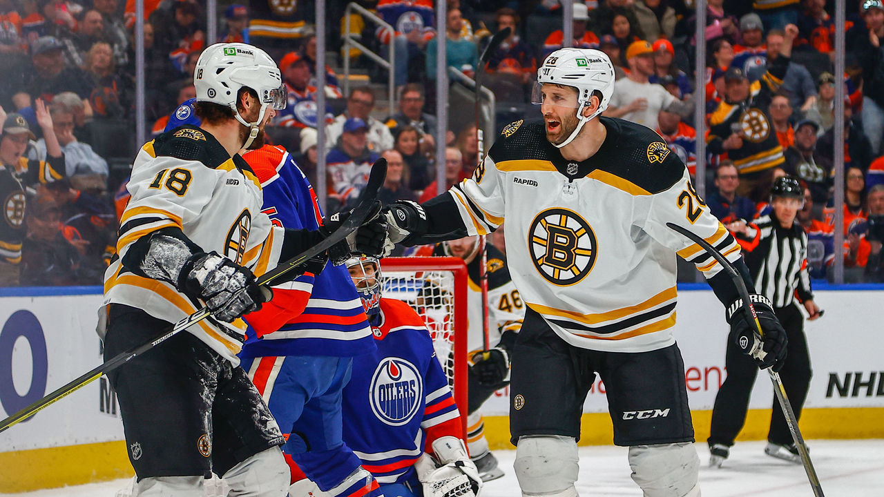 EDMONTON, AB - FEBRUARY 27: Boston Bruins Winger Pavel Zacha (18) and Boston Bruins Defenceman Derek Forbort (28) celebrate a goal in the second period of the Edmonton Oilers game versus the Boston Bruins on February 27, 2023 at Rogers Place in Edmonton, AB.